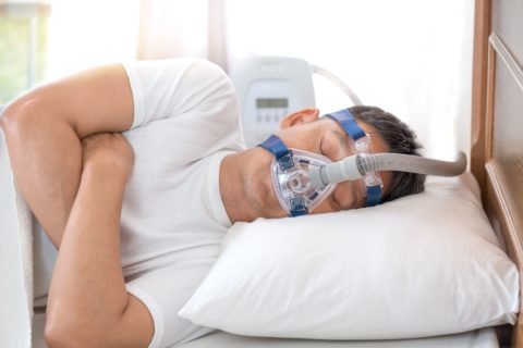 man with sleep apnea machine