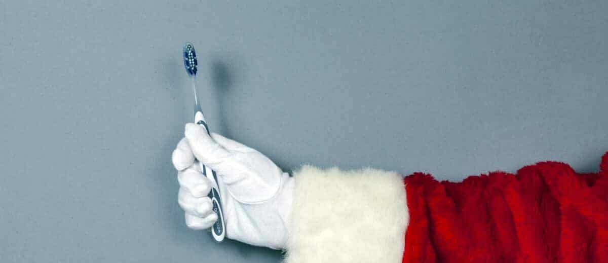 santa holding a toothbrush