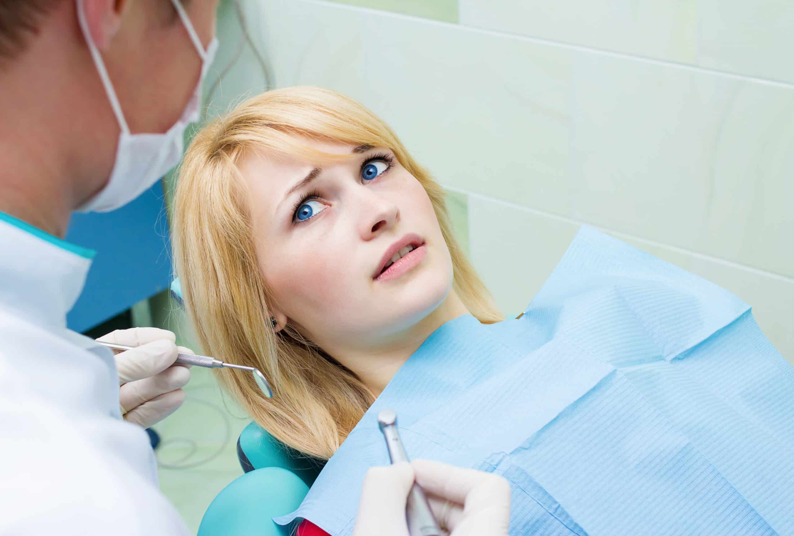 scared woman at dentist