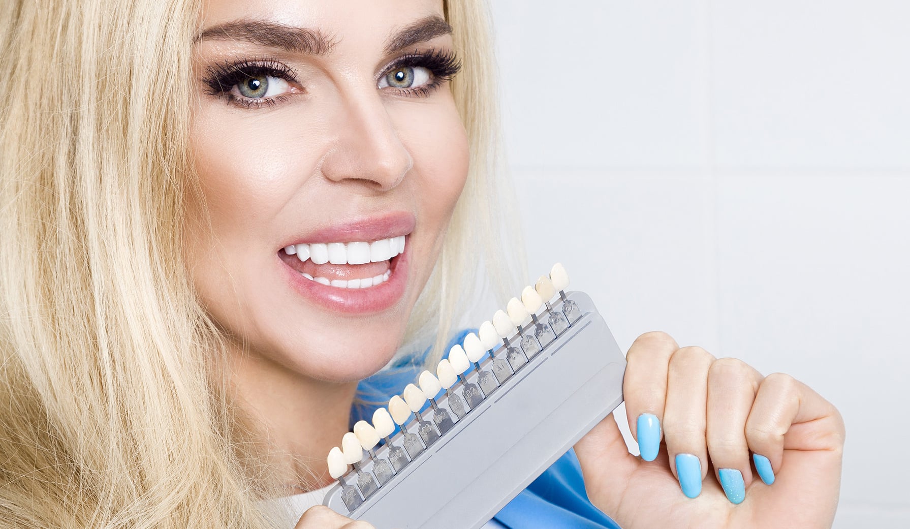 woman holding teeth shades