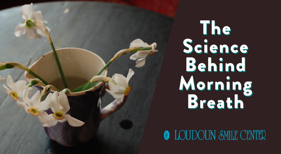 A man sleeps on his back with his mouth slightly open. He rests on white bedding under a cool light.