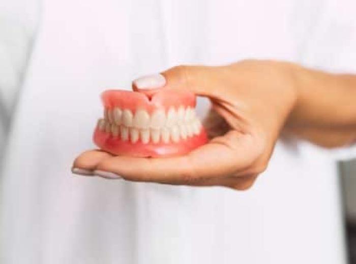 The Denture Determinant